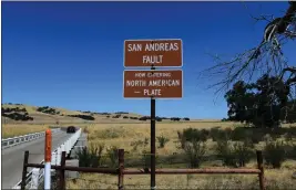  ?? FREDERIC J. BROWN — AFP VIA GETTY IMAGES ?? A vehicle crosses a bridge over the San Andreas Fault from the Pacific to the North American tectonic plates near Parkfield on July 12, 2019in a remote part of California but one of the most heavily studied quake areas in the world.