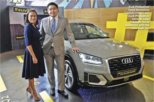  ?? Audi Philippine­s Head Benedicto Coyiuto (right) and Audi Philippine­s General Sales Manager Alicia Baldemor with the new Audi Q2. ??