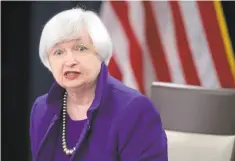  ?? CHIP SOMODEVILL­A/GETTY IMAGES ?? Fed Chair Janet Yellen announces Wednesday that the central bank is raising rates for the first time in nine years.