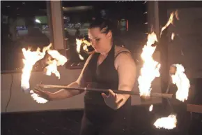  ?? GARY C. KLEIN/USA TODAY NETWORK-WISCONSIN ?? Valerie Ringwell of Sheboygan works a fire baton during a demonstrat­ion of her fire eating skills. Ringwell is creating a calendar after being sexually assaulted with hopes to help others with assaults.