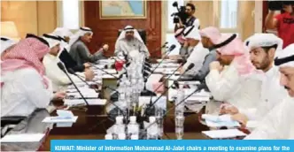  ?? KUNA ?? KUWAIT: Minister of Informatio­n Mohammad Al-Jabri chairs a meeting to examine plans for the National days’ celebratio­ns.—