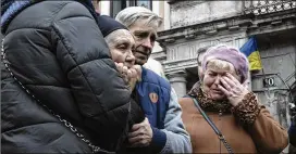  ?? NARIMAN EL-MOFTY/ASSOCIATED PRESS ?? The mother of Senior Lt. Oliynyk Dmytro, 40, killed in action, mourns his death during his funeral Saturday outside the Holy Apostles Peter and Paul Church in Lviv, western Ukraine.