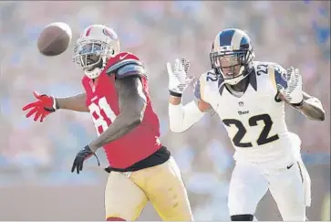 ?? Paul Kitagaki Jr. Sacramento Bee/MCT ?? RAMS CORNERBACK Trumaine Johnson, right, has held his own against receivers such as former San Francisco 49er Anquan Boldin, intercepti­ng 16 passes in five NFL seasons, a career-high seven in 2015.