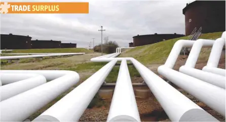  ?? — Reuters ?? Pipelines run to Enbridge Inc’s crude oil storage tanks at their tank farm in Cushing, Oklahoma.