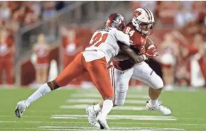  ?? GETTY IMAGES ?? Redshirt freshman tight end Jake Ferguson (right) impressed Wisconsin coach Paul Chryst with his play Friday night against Western Kentucky.