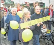  ?? ?? Children joining the march held a banner saying: “We need A + E at K + C”