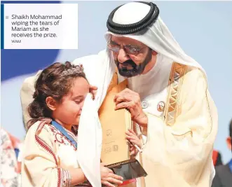  ??  ?? Shaikh Mohammad wiping the tears of Mariam as she receives the prize. WAM