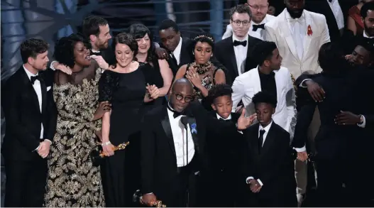  ?? Picture: AP ?? RIGHTFUL WINNERS: Barry Jenkins, foreground center, and the cast accept the award for best picture for “Moonlight” at the Oscars on Sunday at the Dolby Theatre in Los Angeles.