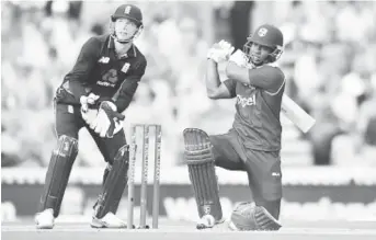  ?? (Photo courtesy CWI Media) ?? Evin Lewis goes big during his 176 in the fourth ODI against England at the Oval.