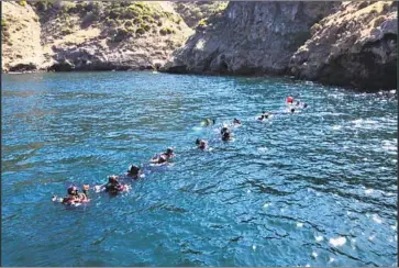  ?? Santa Barbara County ?? DIVERS and support crews work the scene of the Conception dive boat fire last week off Santa Cruz Island. Dive leaders emphasize the importance of ensuring their team members aren’t suffering greatly from stress.