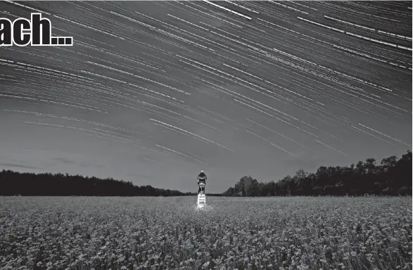  ??  ?? TO REACH THE STARS is a photo of a field of Shasta Daisies in Minnesota with star trails with Walinski doing light painting at the center of the photo.
