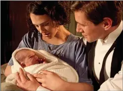  ??  ?? Touching: Lady Sybil and husband Tom with their new daughter