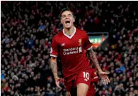  ?? — Reuters ?? Liverpool’s Philippe Coutinho celebrates a goal.