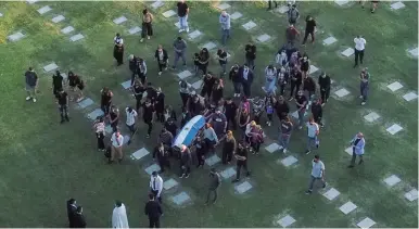  ?? AFP/IVAN PISARENKO ?? Drone footage of the coffin carrying the remains of Diego Armando Maradona, as it is moved to his burial site at the Jardin Bella Vista cemetery, in Buenos Aires Province.