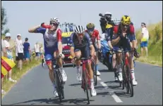  ?? Associated Press ?? Switzerlan­d’s Stefan Kueng (left) drinks as Denmark’s Mads Pedersen (second left), Britain’s Fred Wright (center rear) and Italy’s Filippo Ganna (right) ride in the breakaway group during the 13th stage of the Tour de France cycling race, Friday, in Saint-Etienne, France.