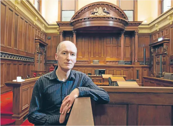  ?? Photo: ROSS GIBLIN/FAIRFAX NZ ?? Legal mind: Victoria University law lecturer Grant Morris, who has written a biography on Chief Justice James Prendergas­t. Prendergas­t: Legal Villain was published by Victoria University Press and supported by the Law Foundation.