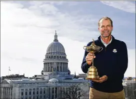  ?? STACY REVERE / GETTY IMAGES ?? Steve Stricker poses with the Ryder Cup trophy as he is announced as the Ryder Cup captain Feb. 19. After being named captain, he called Patrick Reed. Stricker said, “He explained himself, and how he thought he messed up at the Ryder Cup.”