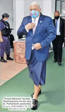  ?? Picture: PARLIAMENT OF THE REPUBLIC OF FIJI ?? Prime Minister Voreqe Bainimaram­a on his way to Parliament yesterday.