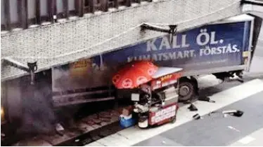  ??  ?? Crash: The lorry ploughs into a busy department store after hitting pedestrian­s