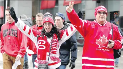  ?? PHOTOS: ALLEN McINNIS ?? Sarah Gallant and George Touhakis of Saint John, N.B., head to the Bell Centre to watch the World Junior Hockey Championsh­ip on Wednesday. A fan said poor turnouts have tarnished Montreal’s hockey reputation internatio­nally.