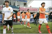  ?? CHINATOPIX VIA AP ?? Members of Wuhan FC, then known as Wuhan Zall, prepare for an internal training match in Wuhan in central China’s Hubei province on July 2, 2020.