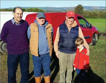  ??  ?? Attending the Castleisla­nd coursing while enjoying the sunshine on Sunday were Tony Horgan, Lisselton, Mickie Sugrue with Paul O Connor and his son Jack from Ballybunio­n.Photo Moss Joe Browne.