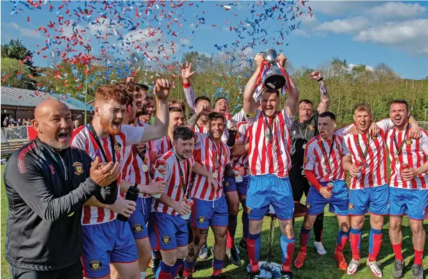  ?? ?? ●●Rossendale boss Ray Davis, left, and his squad celebrate their title triumph and promotion