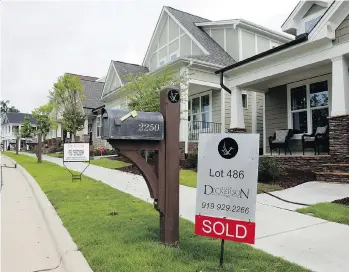  ?? GERRY BROOME/THE ASSOCIATED PRESS ?? With just a few smart decisions, such as creating an emergency fund and getting an energy-efficiency audit, new homeowners can get home ownership off to a positive start.