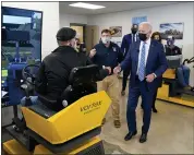  ?? EVAN VUCCI — THE ASSOCIATED PRESS ?? President Joe Biden tours the Internatio­nal Union Of Operating Engineers Local 324trainin­g facility on Tuesday in Howell. Biden is joined by Rep. Elissa Slotkin, D-Mich., Michigan Lt. Gov. Garlin Gilchrist and Michigan Gov. Gretchen Whitmer.