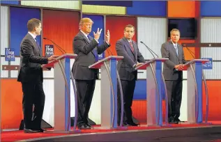  ?? ASSOCIATED PRESS ?? Republican presidenti­al candidate Donald Trump (second from left) shows his hands as Marco Rubio (from left), Ted Cruz and John Kasich watch him during Thursday’s Republican debate in Detroit.