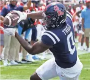  ?? ROGELIO V. SOLIS/AP ?? Ole Miss tight end Michael Trigg caught three touchdowns in the Grove Bowl.