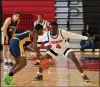  ?? RICH HUNDLEY III — FOR THE TRENTONIAN ?? Trenton’s Davontay Hutson (4) defends as Nottingham’s Nazir Collins (13) looks to drive to the basket during a boys basketball game at Tornado Alley on Monday afternoon.