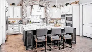  ?? Courtesy of Caldwell Homes ?? Caldwell Homes’ kitchens offer modern appliances, islands, and plenty of cabinet space.
