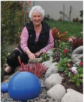 ??  ?? BELOW: Gloria in her rock garden.OPPOSITE FROM LEFT TO RIGHT: Getting ready for Copper Crest’s Christmas Fayre; salad greens and strawberri­es; succulents in Dulcie’s garden.