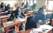 ?? ANI ?? Class 10 students taking the board exam at Budgam district on Tuesday.