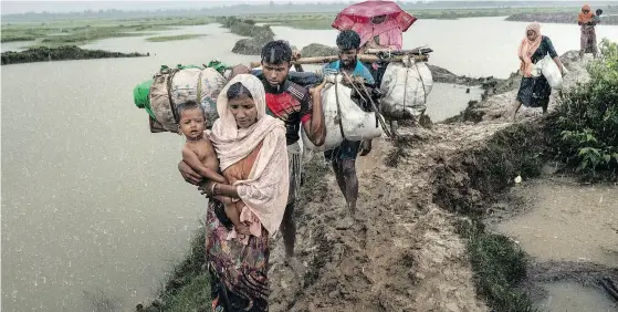  ?? ADAM DEAN / THE NEW YORK TIMES ?? Thousands of Rohingya refugees have fled Myanmar for Bangladesh in the face of ethnic violence that critics say Aung San Suu Kyi has failed to halt.
