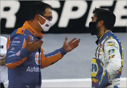  ?? PHOTOS: MARK HUMPHREY — THE ASSOCIATED PRESS ?? Drivers Joey Logano, left, and Chase Elliott talk after the leaders crashed each other near the finish of the NASCAR Cup Series race in Bristol, Tenn.