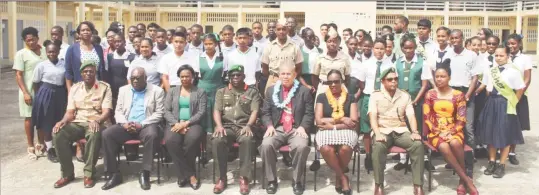  ??  ?? Officials from the ministries of Education and Social Cohesion, along with officers from the Guyana Defence Force, pose with students and teachers at the launch of the National Cadet Corps Programme yesterday. Seated in the photo are: Chief Education...