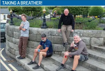  ??  ?? Gordon Lucas, Paul Carroll, Dave Reilly and Tony Reilly enjoying a break during their cycle in Enniskerry.