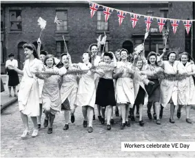  ??  ?? Workers celebrate VE Day