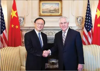  ?? YIN BOGU / XINHUA ?? Chinese State Councilor Yang Jiechi meets with US Secretary of State Rex Tillerson on Tuesday in Washington.