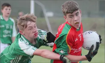  ??  ?? Shane Farrell of Starlights comes under pressure from Cormac Doyle (Naomh Eanna).