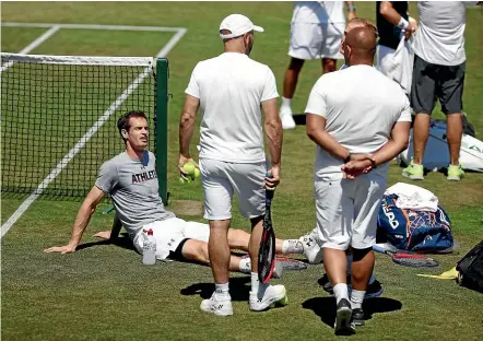  ?? AP ?? Andy Murray takes a break on a hot day during a practice session ahead of the Wimbledon Championsh­ips. Murray plays France’s Benoit Paire in the first round.