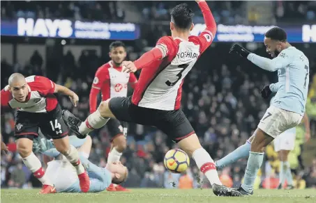  ??  ?? Raheem Sterling fires home Manchester City’s last-gasp winner to sink Southampto­n at the Etihad last night.