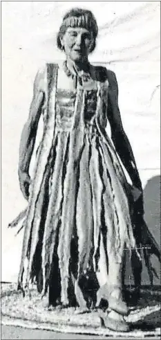  ?? COURTESY — GREELEY HISTORY MUSEUM ?? In this photo dated October 1955, Rattlesnak­e Kate is pictured wearing her iconic flapper dress made from the skins of rattlesnak­es she killed.