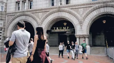  ?? GABRIELLA DEMCZUK/THE NEW YORK TIMES 2019 ?? Baseless election fraud claims and the Capitol riot have compounded already looming threats to Donald Trump’s bottom line. And the cash lifelines he relied on are gone. Above, the Trump Internatio­nal Hotel in Washington.