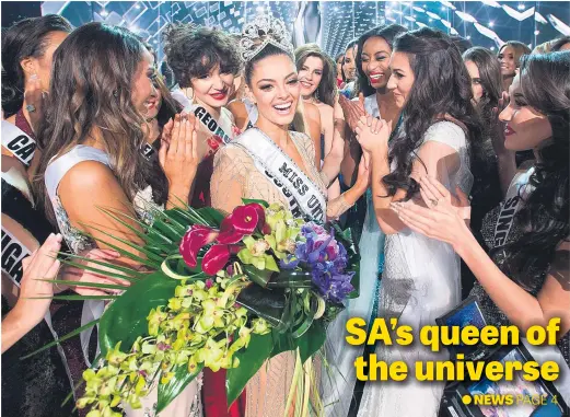  ?? Picture: AFP ?? Pure joy as Demi-Leigh Nel-Peters, Miss South Africa 2017, is congratula­ted on Sunday by fellow contestant­s after being crowned Miss Universe at the Planet Hollywood Resort & Casino in Las Vegas.