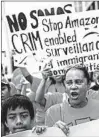  ?? KEVIN HAGEN/GETTY ?? Protesters in New York march to a building where Amazon owner Jeff Bezos owns property, on Amazon Prime Day.