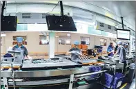  ?? LU XIAOJUAN / FOR CHINA DAILY ?? Technician­s with Guiyang Hisense Electronic­s assemble flat-screen television sets on the company’s production line.