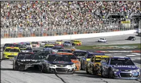  ?? JEFF ZELEVANSKY / GETTY IMAGES ?? Jimmie Johnson, driver of the No. 48 Lowe’s Chevy, won the 2016 Folds of Honor QuikTrip 500 at Atlanta Motor Speedway and said he’ll be sad to see the old pavement go.